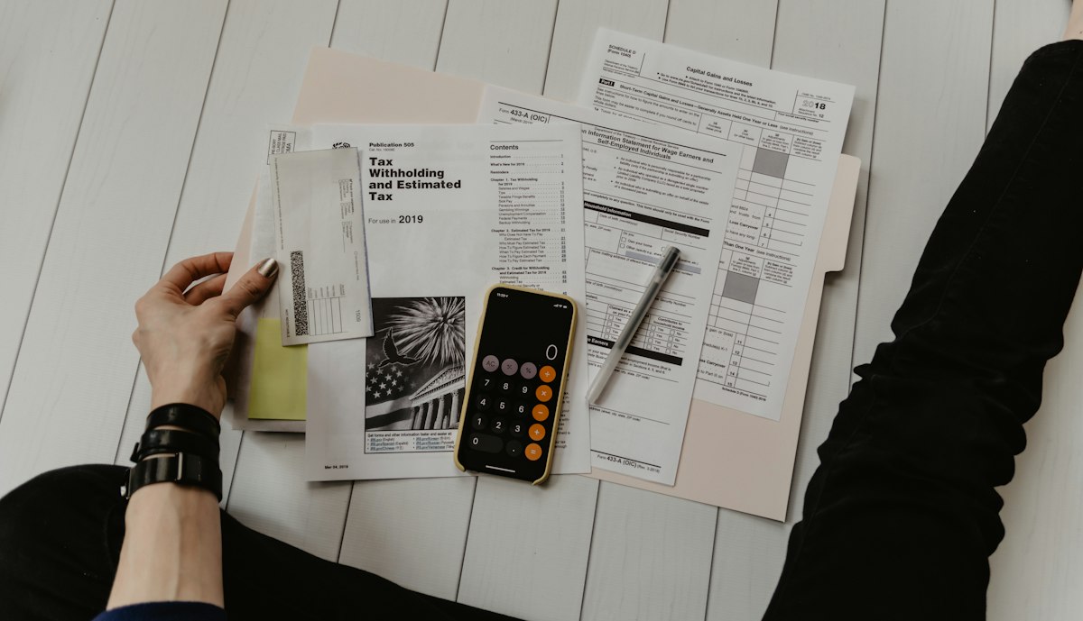 Two people discussing documents during a financial planning meeting